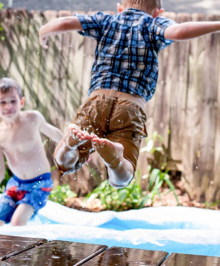 Kids playing in a pool outdoors